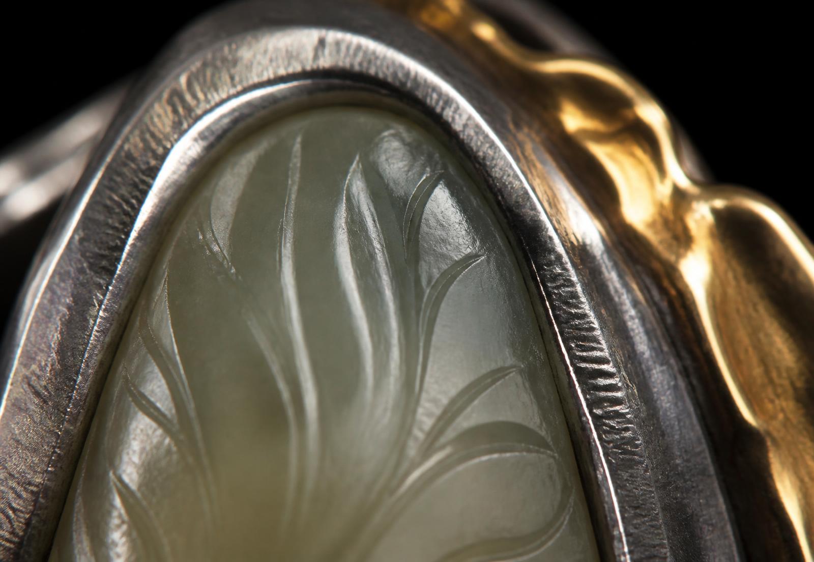 Macro detail of a hand-carved stone set into hand-fabricated silver